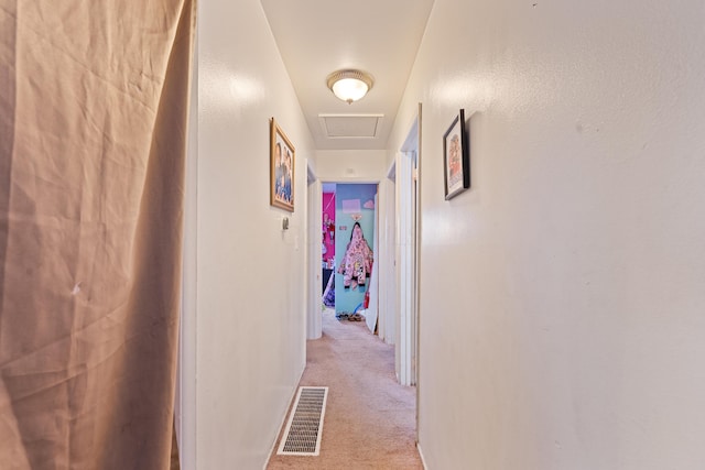 hall with light colored carpet