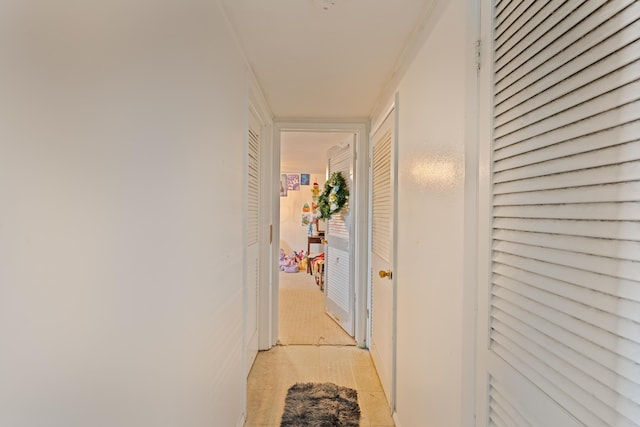 corridor featuring ornamental molding