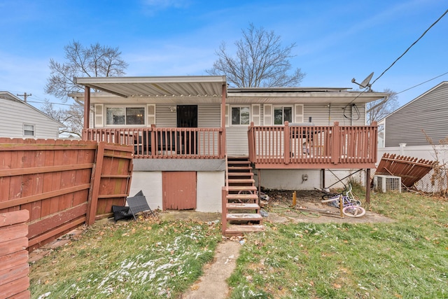 back of house featuring a deck