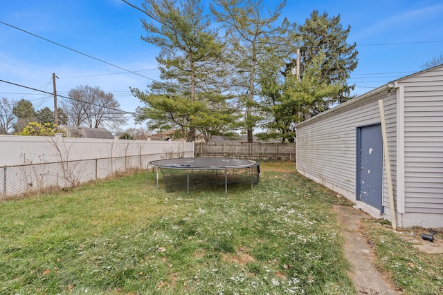 view of yard with a trampoline