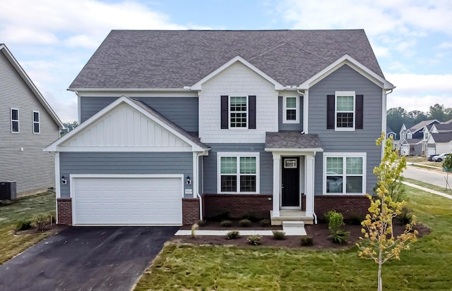 9809 Glenfield Ave Lot 2, Plain City, OH 43064 - view of front of home featuring asphalt driveway, roof with shingles, brick siding, and a front yard