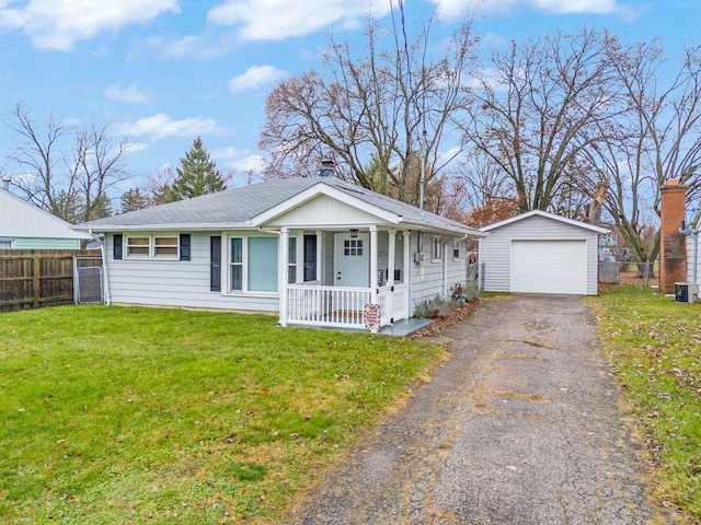 ranch-style house with a front yard, covered porch, an outdoor structure, and a garage