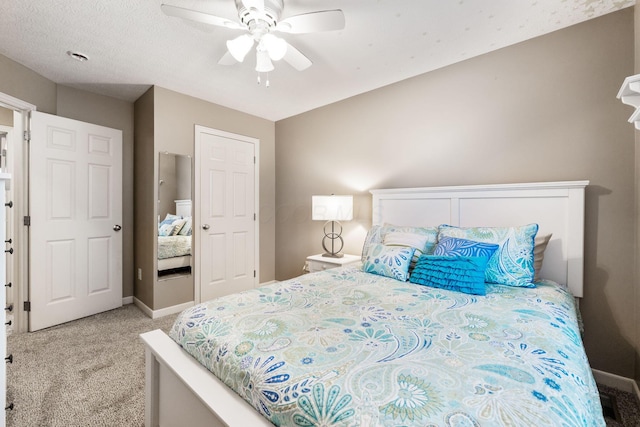 bedroom with baseboards, a ceiling fan, and light colored carpet