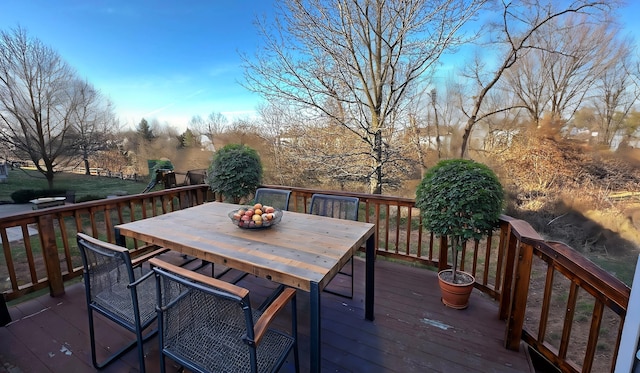 wooden terrace featuring outdoor dining area