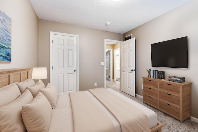 bedroom featuring light carpet, baseboards, and visible vents