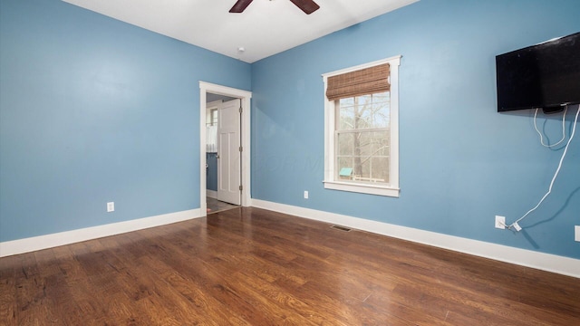 empty room featuring ceiling fan and wood-type flooring