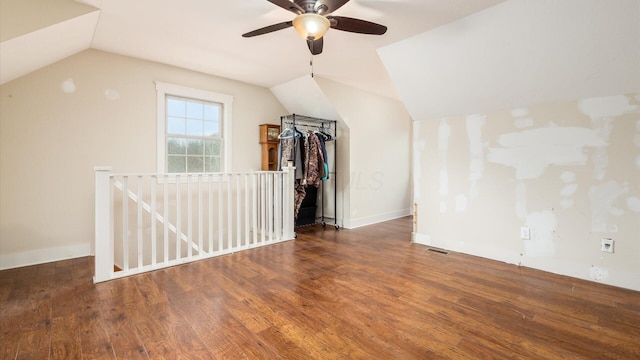 additional living space featuring lofted ceiling, ceiling fan, and dark hardwood / wood-style floors