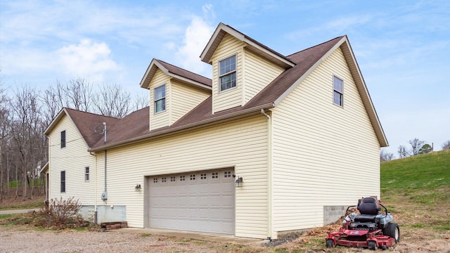 view of side of property featuring a garage