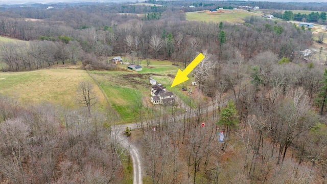 birds eye view of property with a rural view