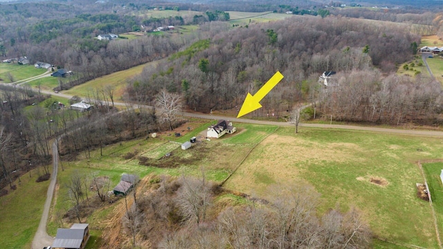 birds eye view of property featuring a rural view