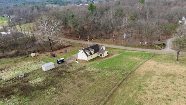 birds eye view of property with a rural view