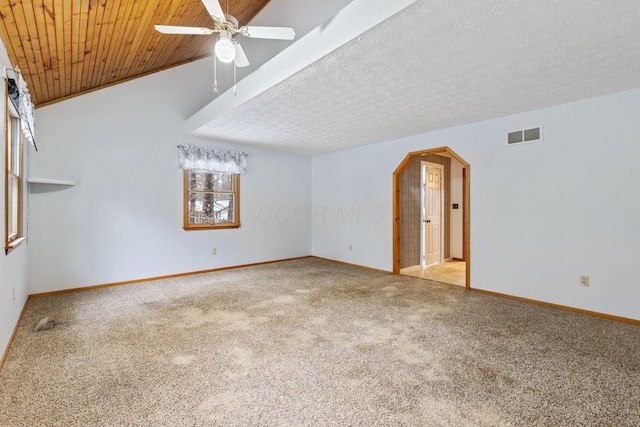 unfurnished living room featuring vaulted ceiling, ceiling fan, a textured ceiling, light colored carpet, and wood ceiling