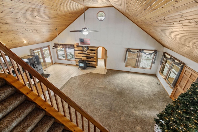 carpeted living room featuring ceiling fan, wooden ceiling, and high vaulted ceiling