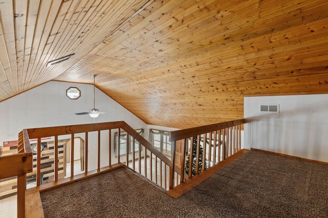 additional living space featuring ceiling fan, carpet, wooden ceiling, and vaulted ceiling