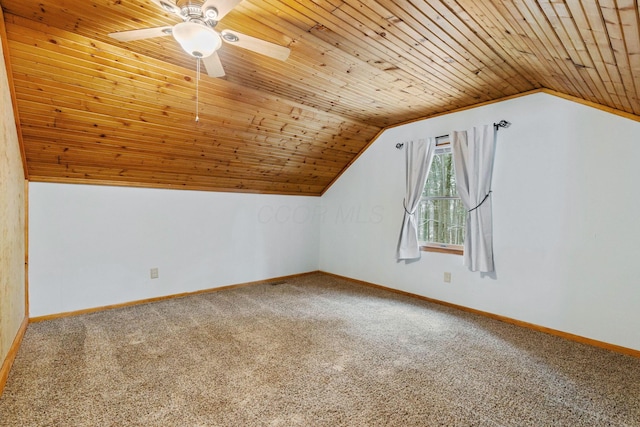 additional living space featuring carpet, wood ceiling, and vaulted ceiling