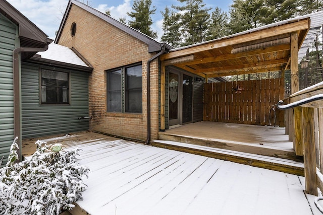 view of snow covered deck