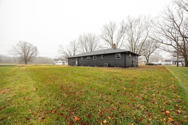 exterior space featuring a yard and cooling unit