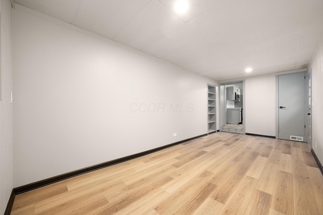 unfurnished room featuring wood-type flooring