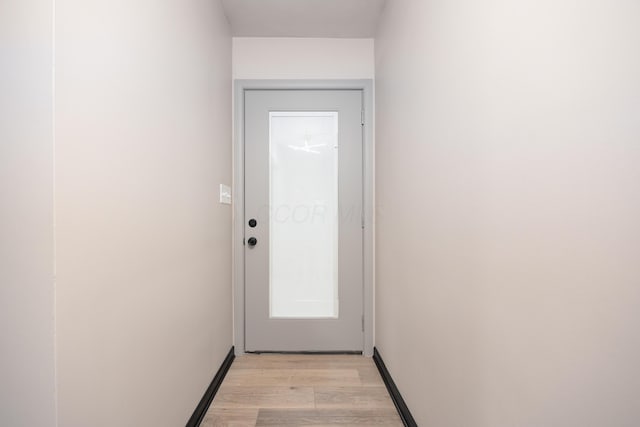 doorway to outside with light hardwood / wood-style floors