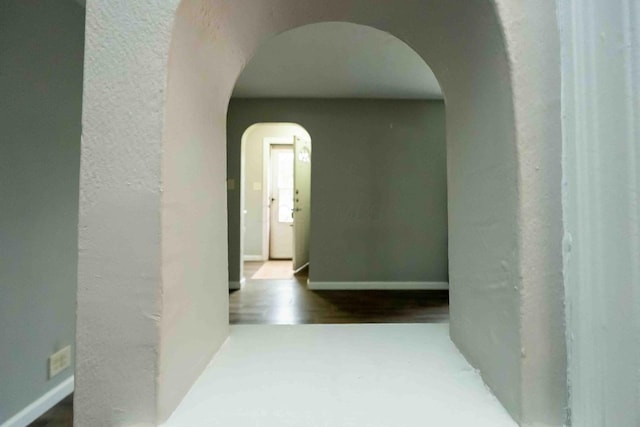 hallway with dark wood-type flooring