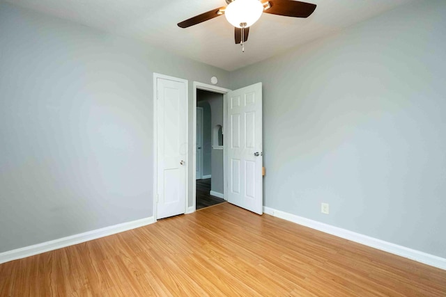 unfurnished bedroom featuring ceiling fan and light hardwood / wood-style flooring