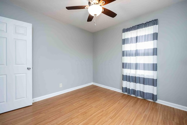 unfurnished room featuring ceiling fan and hardwood / wood-style flooring