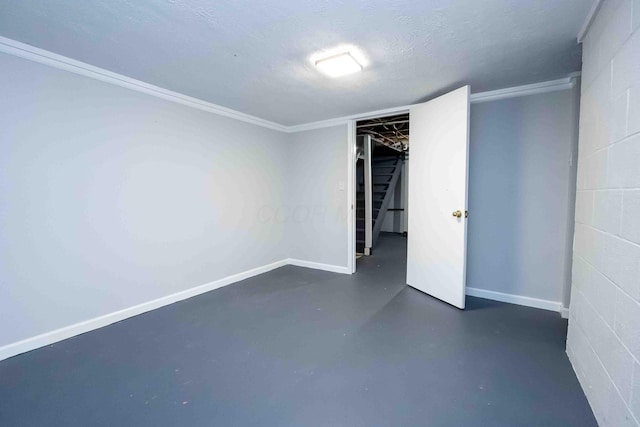 unfurnished bedroom with a textured ceiling and crown molding