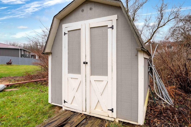 view of outbuilding with a lawn