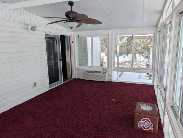 unfurnished sunroom featuring a wall mounted air conditioner, vaulted ceiling, and ceiling fan