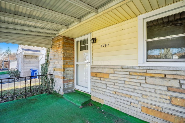 doorway to property featuring a porch