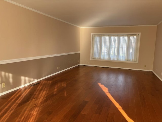 unfurnished room with crown molding and dark wood-type flooring