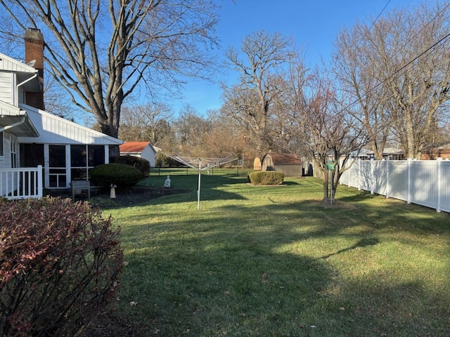 view of yard with a sunroom