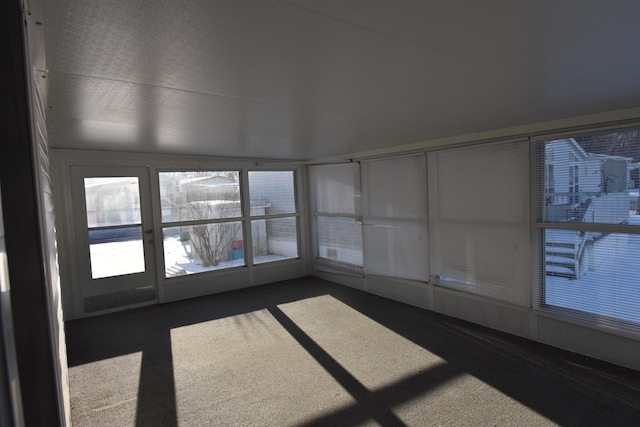 unfurnished sunroom with a healthy amount of sunlight