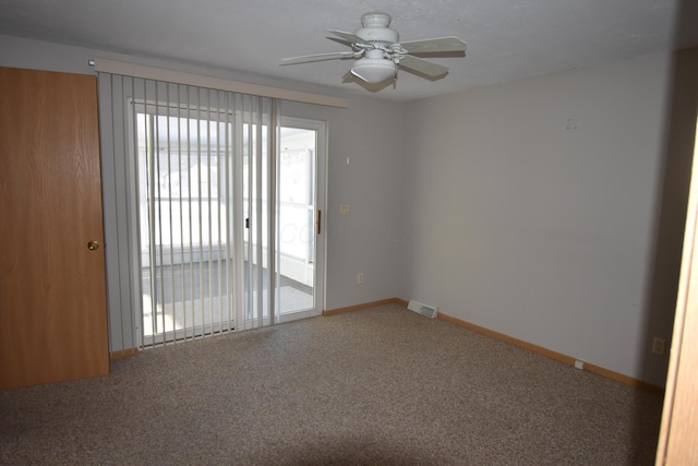 carpeted empty room with ceiling fan