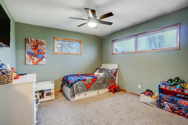 bedroom with ceiling fan and carpet floors