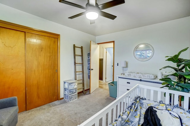 bedroom with light carpet, a closet, and ceiling fan