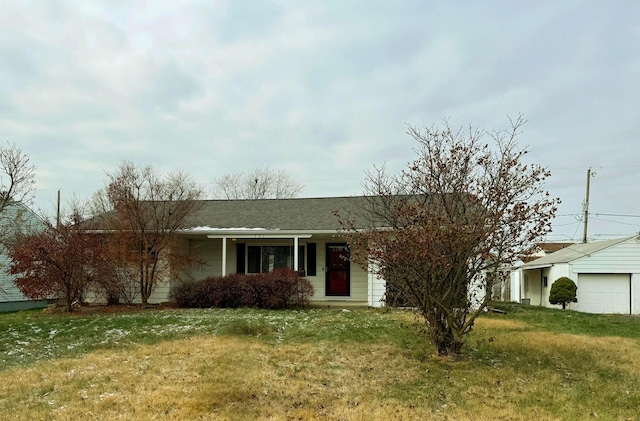 single story home with a garage and a front lawn