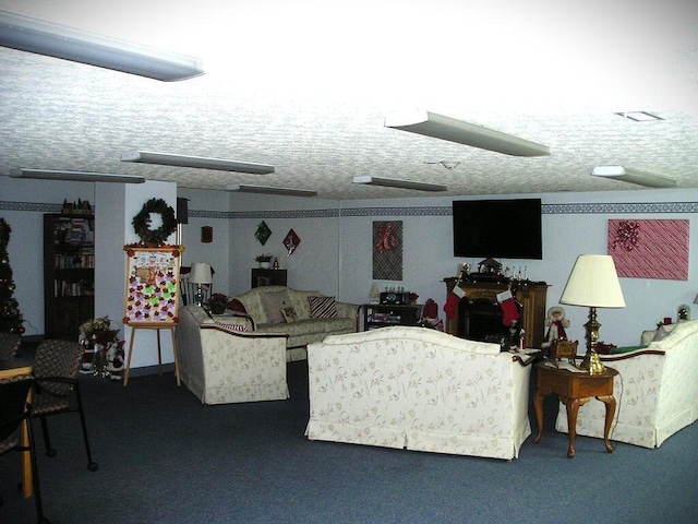 living room featuring carpet flooring and a textured ceiling