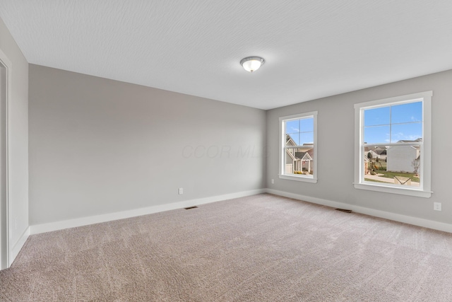 unfurnished room featuring carpet floors