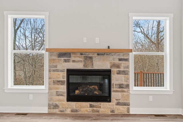 room details featuring a fireplace and hardwood / wood-style floors