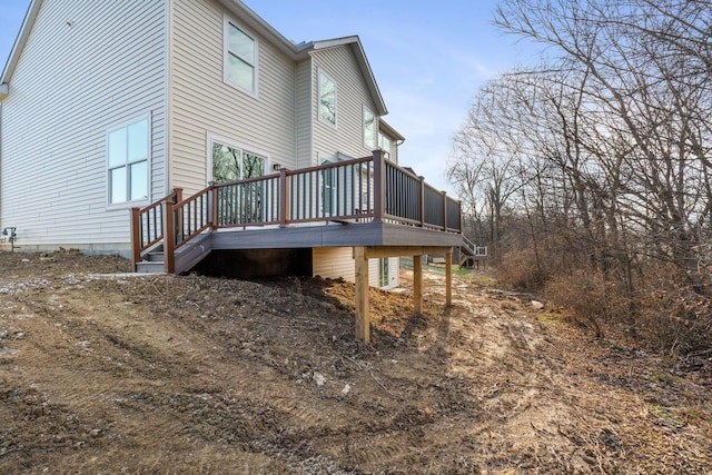 view of side of property featuring a wooden deck