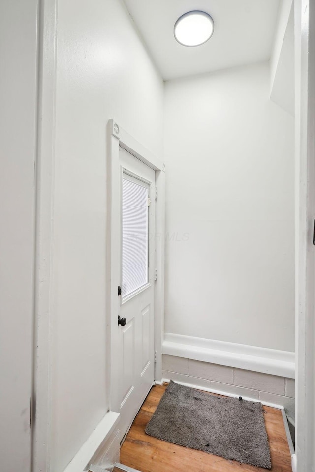 entryway with hardwood / wood-style flooring