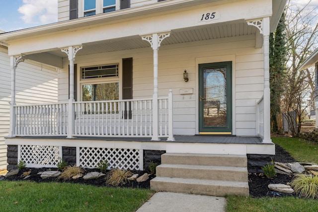 property entrance featuring a porch