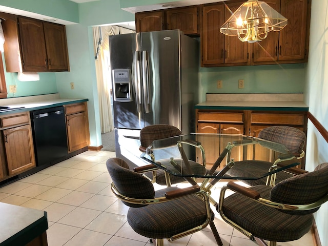 kitchen with dishwasher, an inviting chandelier, stainless steel refrigerator with ice dispenser, pendant lighting, and light tile patterned floors