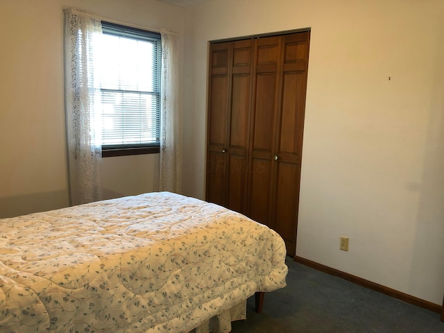 carpeted bedroom with a closet