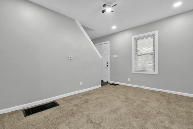 carpeted empty room with a ceiling fan, recessed lighting, visible vents, and baseboards