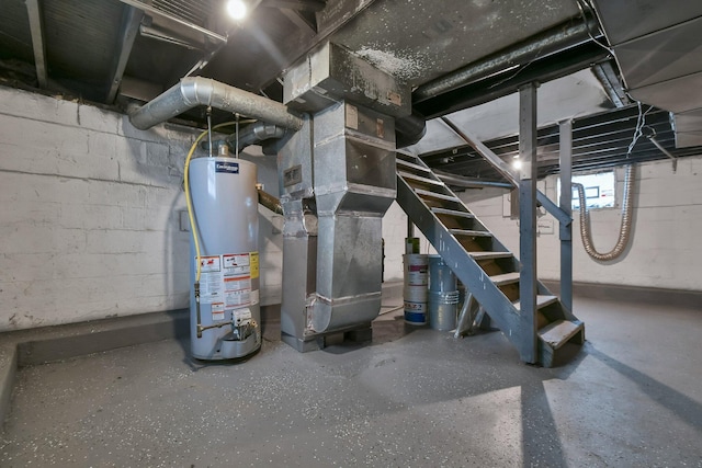 utility room featuring heating unit and gas water heater