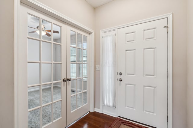 entryway featuring ceiling fan, dark hardwood / wood-style flooring, and french doors