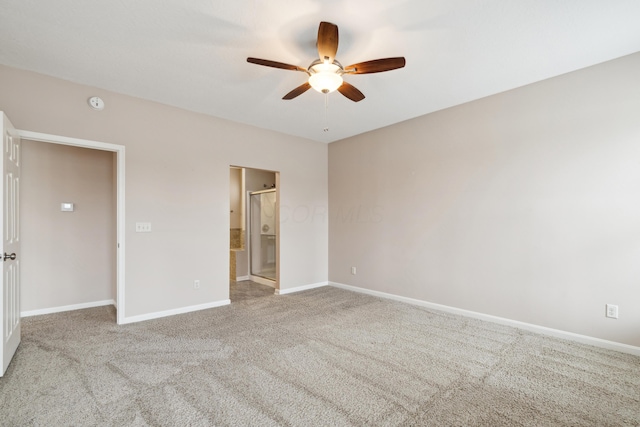 unfurnished bedroom featuring ensuite bathroom, ceiling fan, and light colored carpet