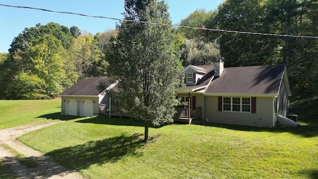 view of front of house with a garage and a front lawn